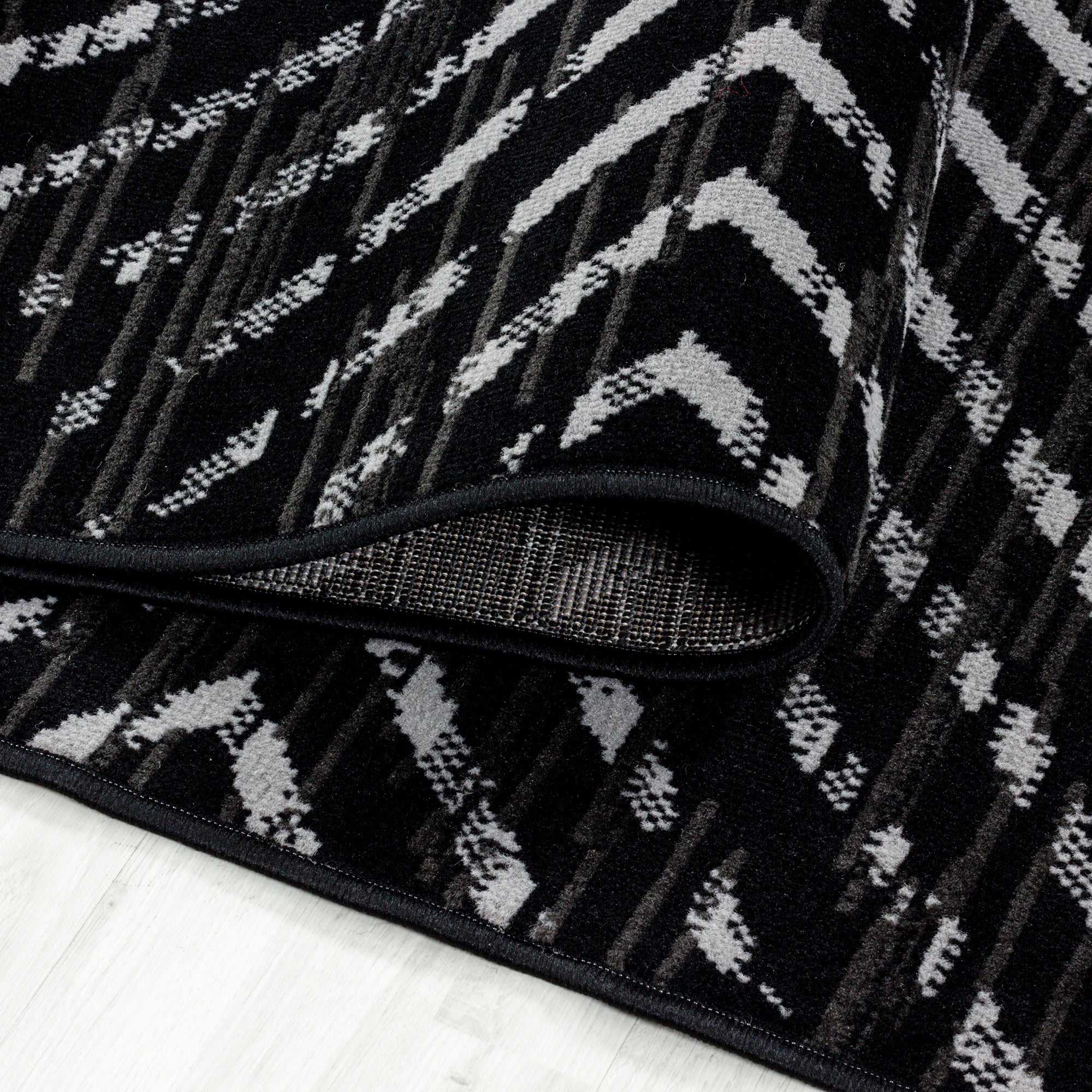 Abstrakter Zickzack-Teppich für den Innenbereich | Schwarz